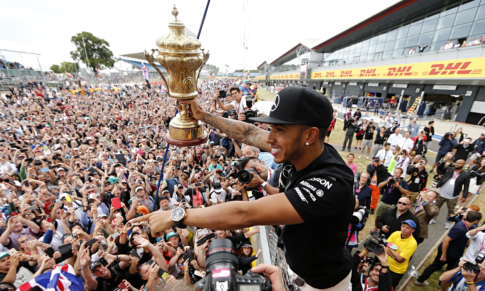 Lewis Hamilton shares a moment with the assembled masses at Silverstone after admitting he struggled